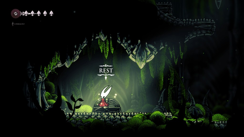 Hornet parado ao lado de um banco de descanso em Silksong