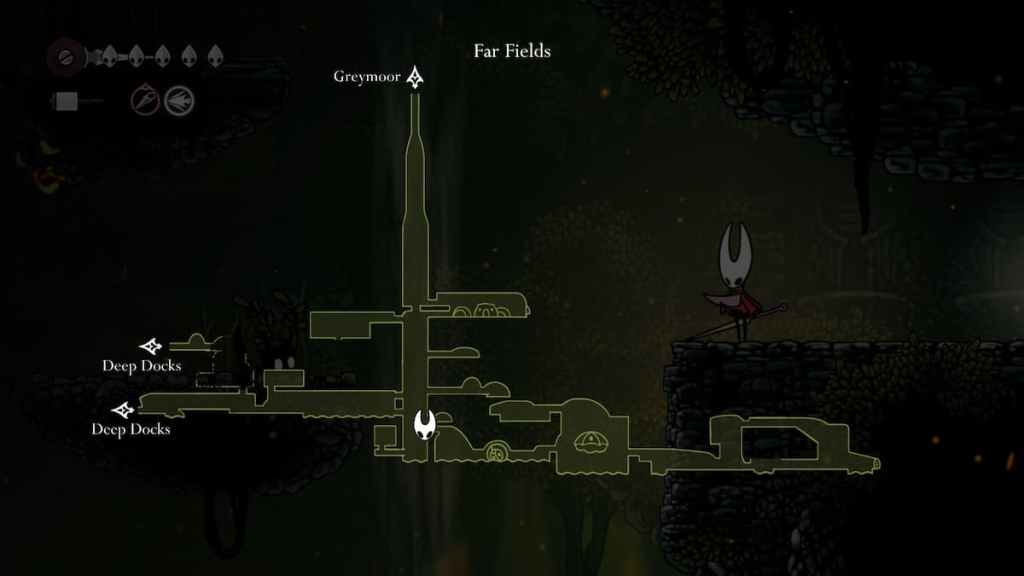 Hornet olhando para um mapa dos campos mais distantes em Hollow Knight Silksong.