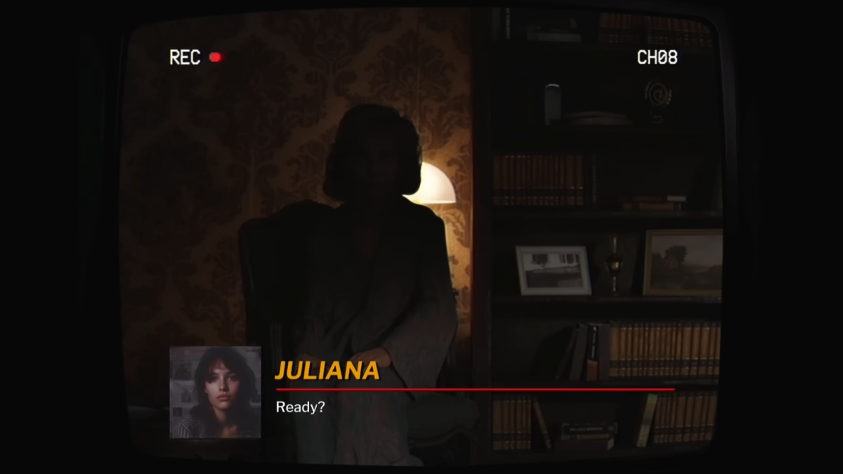 Juliana perguntando a Adriana se ela está pronta para a entrevista. Tiro apontando para Adriana nas sombras, sentado em sua poltrona