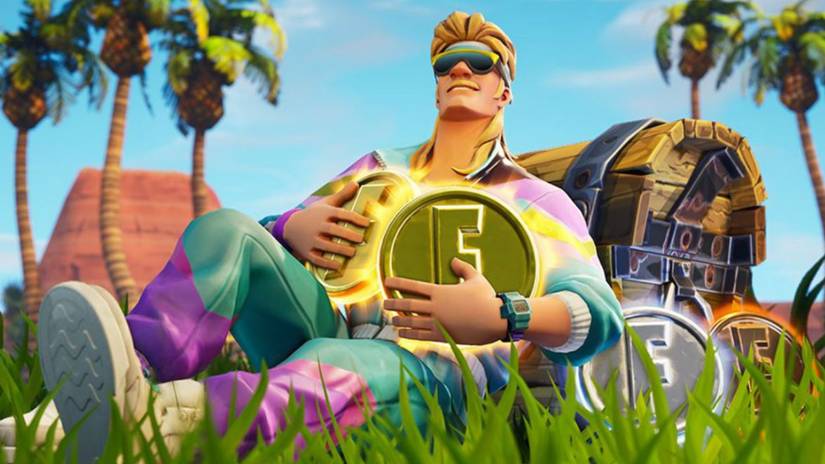 Um personagem fortnita loiro e masculino usando óculos de sol relaxa na grama, as pernas cruzadas, encostadas em um baú do tesouro e segurando moedas de ouro com o logotipo do Fortnite no peito.