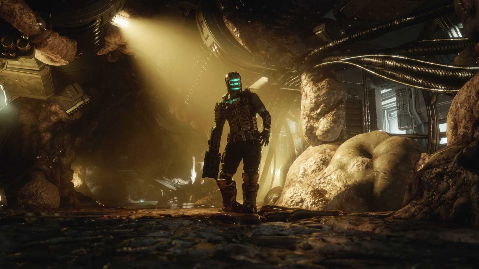 Isaac Clarke, usando o traje de equipamento, se move pelos corredores carnudos de uma parte infestada do USG Ishimura no remake do espaço morto.