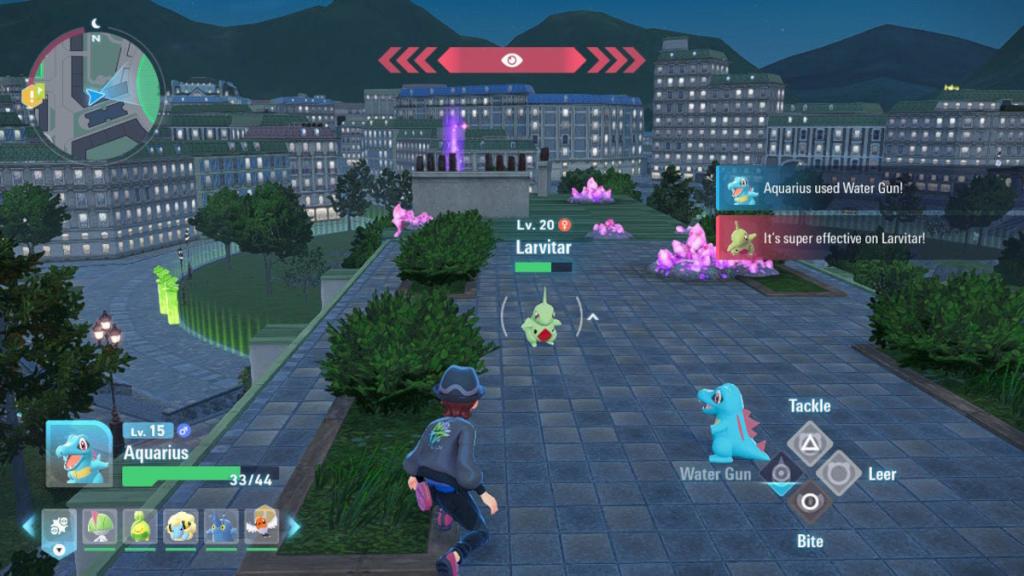 Um treinador e seu Totodile lutando contra um Larvitar em Pokémon Legends ZA.