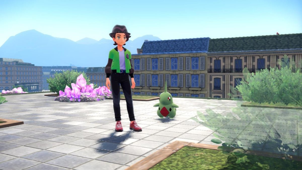 Um treinador ao lado de Larvitar em Pokémon Legends: ZA.