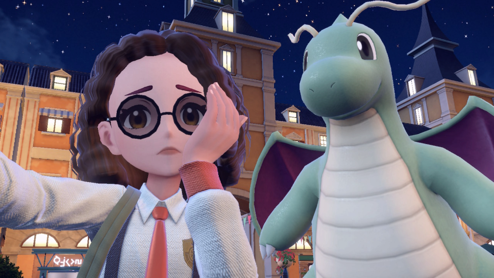 uma imagem de um treinador Pokémon em Pokémon Scarlet tirando uma selfie com um dragonite brilhante. ela parece preocupada na foto.
