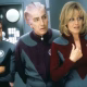 Tim Allen, Alan Rickman e Sigourney Weaver vestindo uniformes estilo Star Fleet em Galaxy Quest.