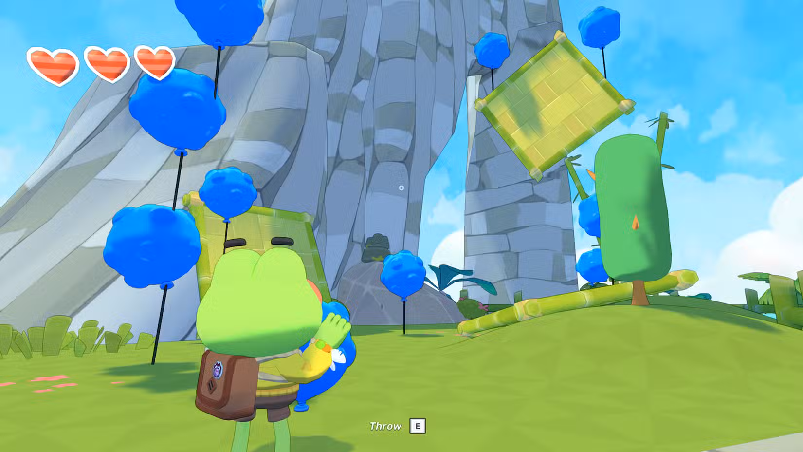 Um sapo olha para balões em Big Hops.