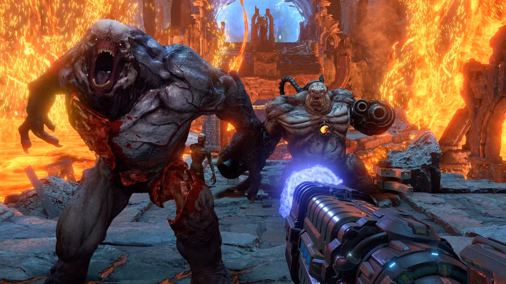 Os monstruosos e demoníacos inimigos de Doom Eternal enfrentam o jogador, cercados por fogo.