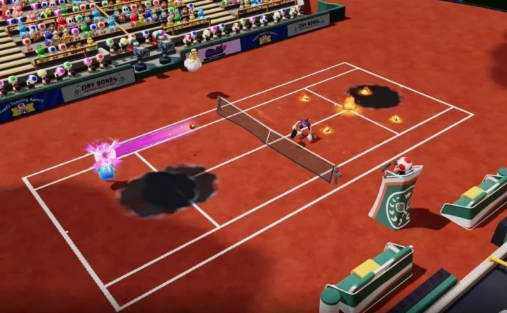 Waluigi e Luma azul jogam tênis em um campo de saibro. Bolas de fogo e respingos de tinta espalham-se pela quadra.