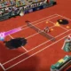 Waluigi e Luma azul jogam tênis em um campo de saibro. Bolas de fogo e respingos de tinta espalham-se pela quadra.