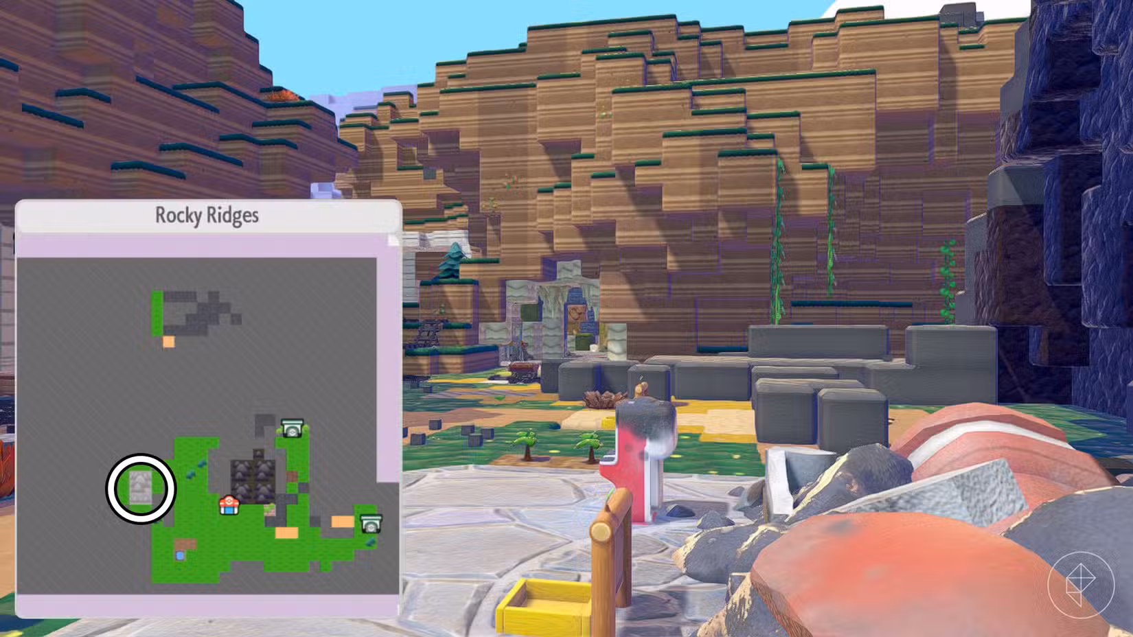 Uma montagem mostrando um mapa de Rocky Ridges e a caverna onde os jogadores podem detonar Graveler