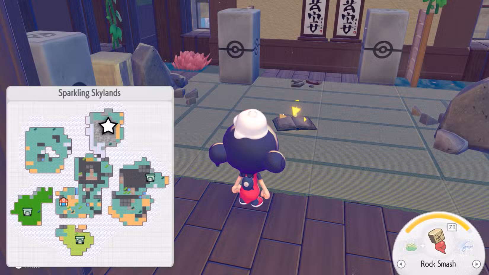 Um livro no chão de um dojo abandonado em Pokopia.