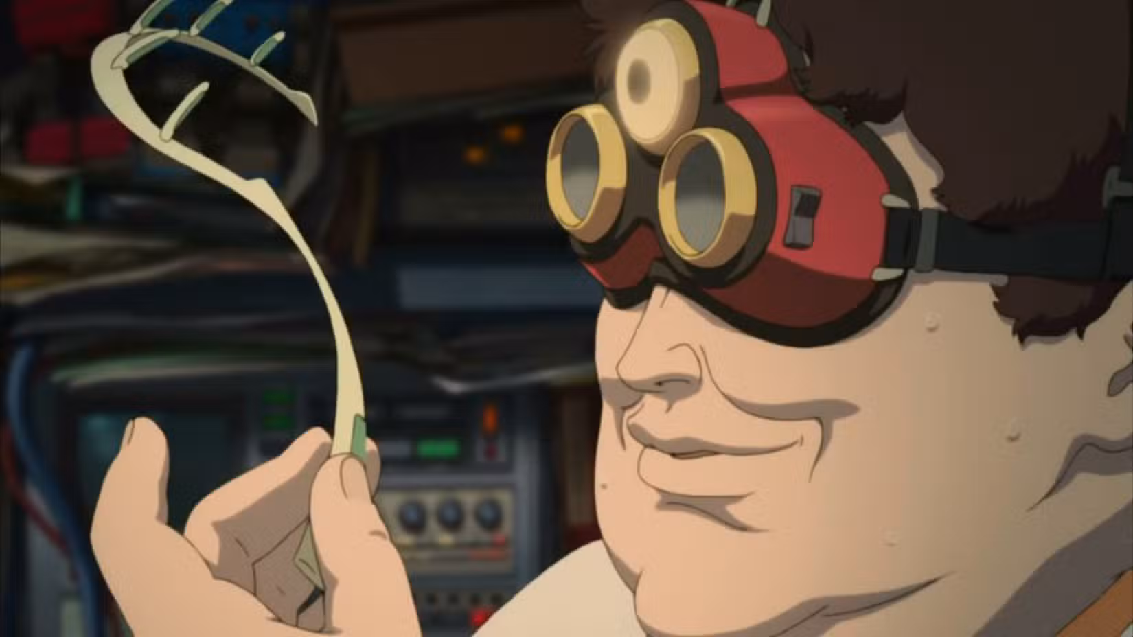 Cena do filme de anime Paprika apresentando o Dr. Tokita segurando o dispositivo DC Mini.