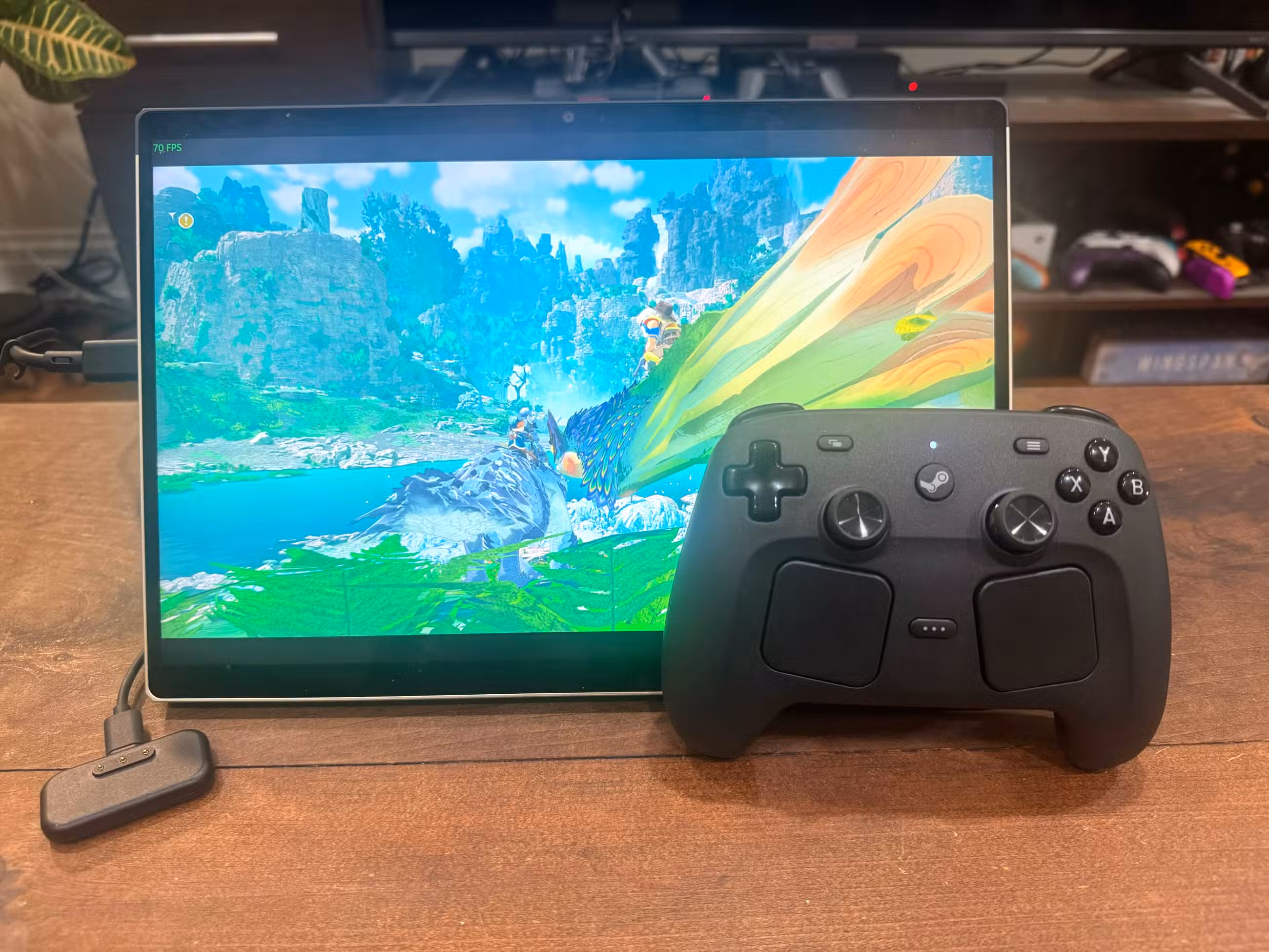Um controlador Steam fica próximo à tela de um tablet.