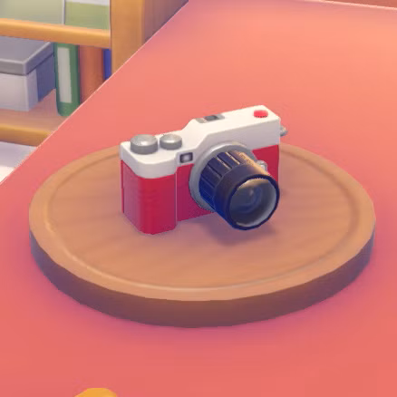 Uma pequena câmera vermelha em Pokopia
