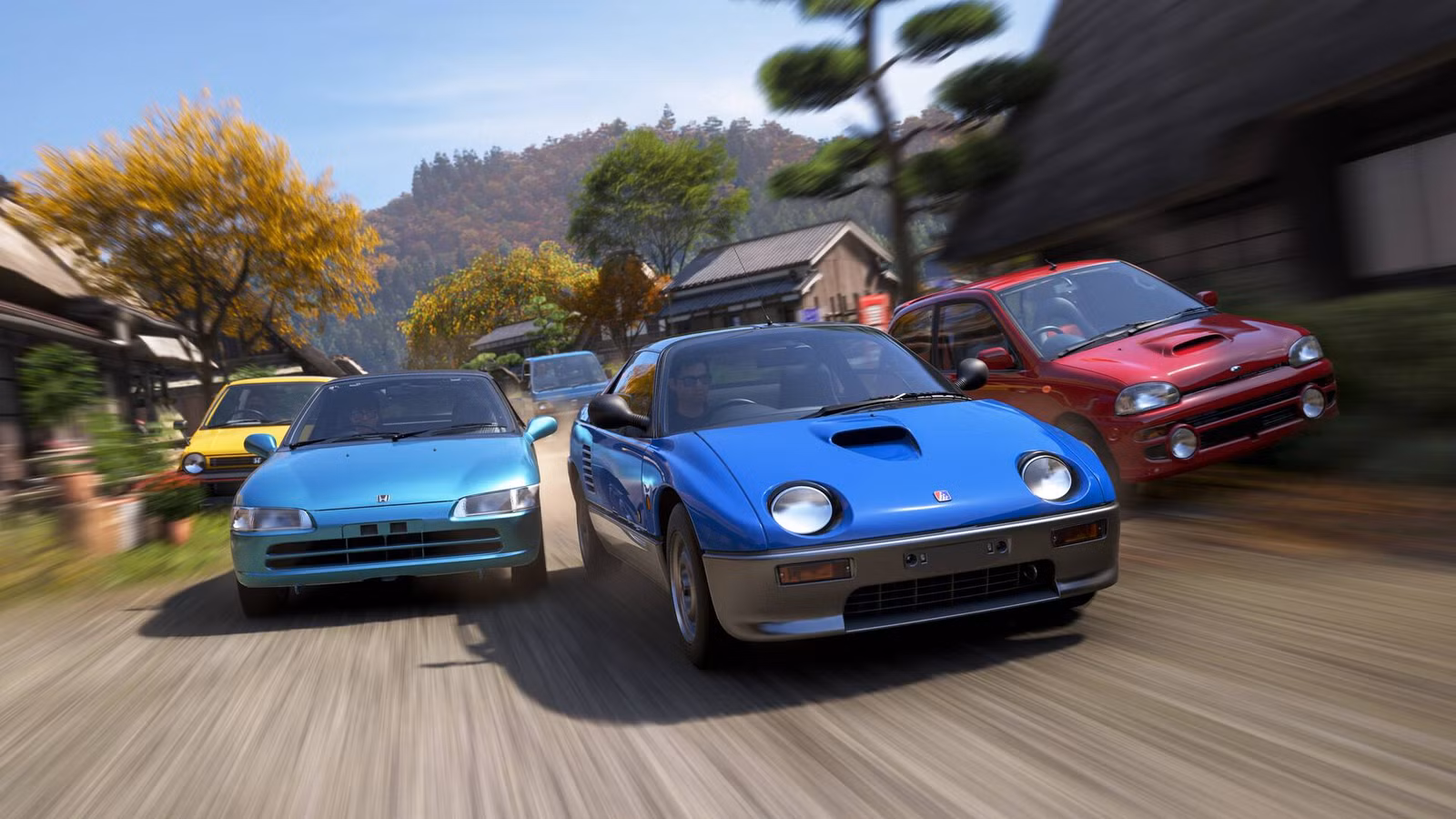 Cinco carros correndo entre algumas pequenas casas no Forza Horizon 6.