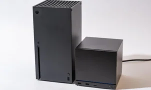An Xbox Series X next to a Steam Machine. The Steam Machine is roughly half the size of the Series X.