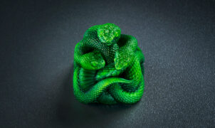 A Razer artisan keycap made of up three resin-cast, neon green snakes