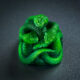 A Razer artisan keycap made of up three resin-cast, neon green snakes